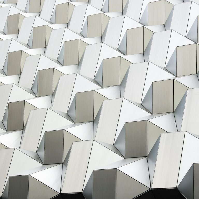 Modern repeating wall pattern symbolizing accessibility, language access, and inclusion at Vista Community Clinic