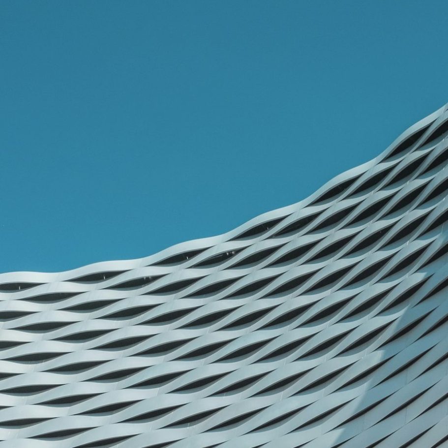 Modern white patterned facade representing civil rights protections for VCC patients