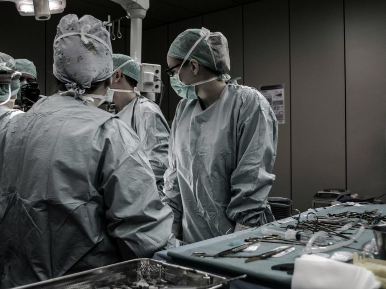 Medical professionals in discussion, representing patient reviews and legal evaluations of Vista Community Clinic’s healthcare practices.